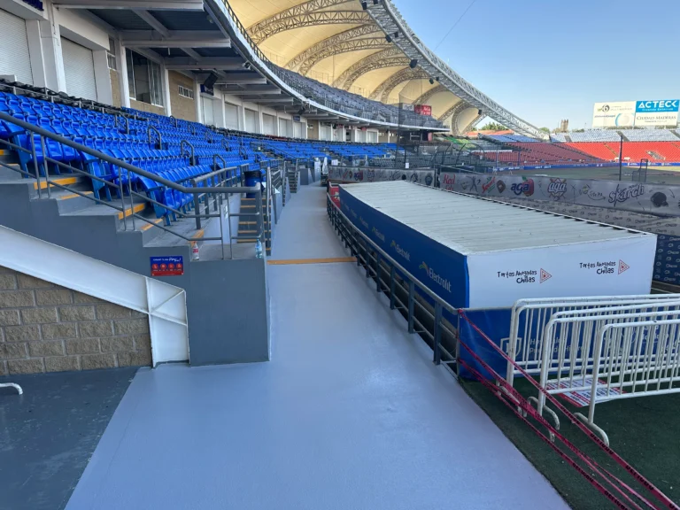 Freshly coated anti-slip gray walkway at Los Chorros Baseball Stadium VIP section, protected with BioBond’s biobased antimicrobial flooring system.
