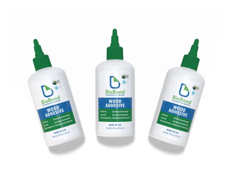 Three bottles of BioBond® Wood Adhesive displayed on a white background. The product label highlights that it is plant-based, PFAS-free, and made in the USA with essentially no VOC and no added microplastics.